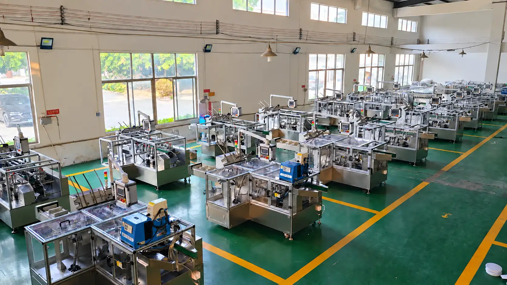 Rows of horizontal cartoning machines in the NEW PACKING factory